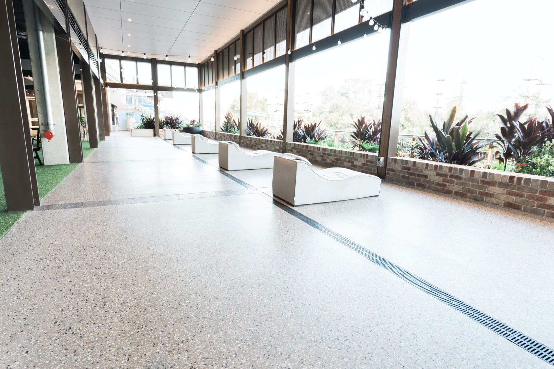 Concrete polishing for residential and commercial floors on the Sunshine Coast and Brisbane. - Honed & Polished Concrete working in the studio